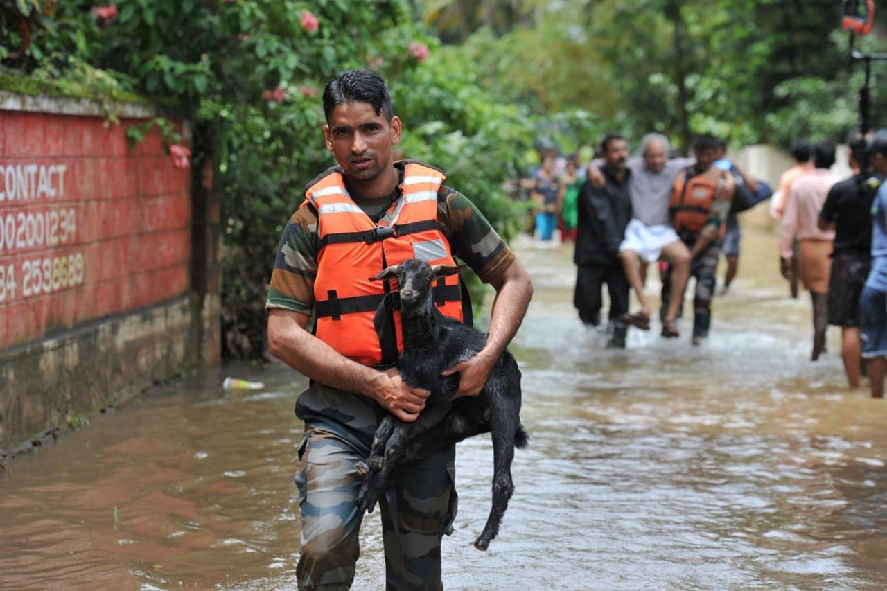 man_with_goat_in_flood_1