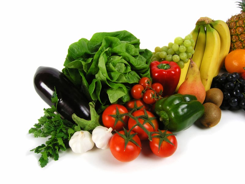 A stock image with fresh fruit and vegetables with a white background