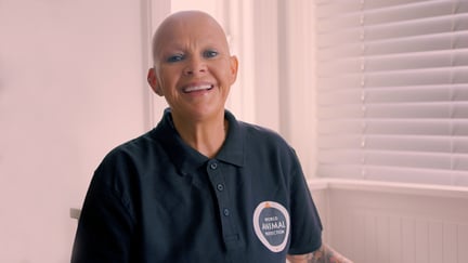 BAFTA award-winning broadcaster Gail Porter is smiling at the camera and wearing a black World Animal Protection t-shirt.