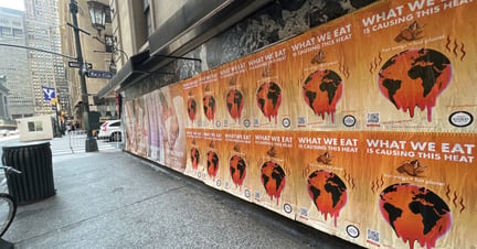 Rows of street posters promoting Climate Week 2022 and the impact our food systems have.